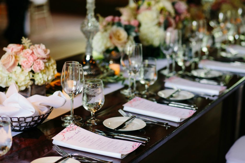 Farm tables and soft pastel floral decor complete the rustic look.